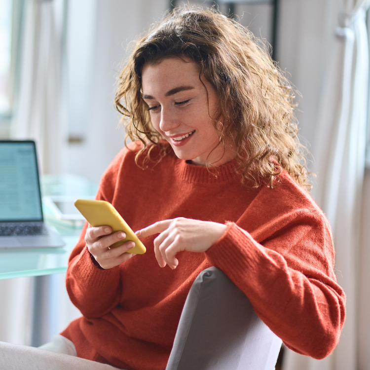 Father and daughter, looking at a tablet at ways to save on their heating costs.