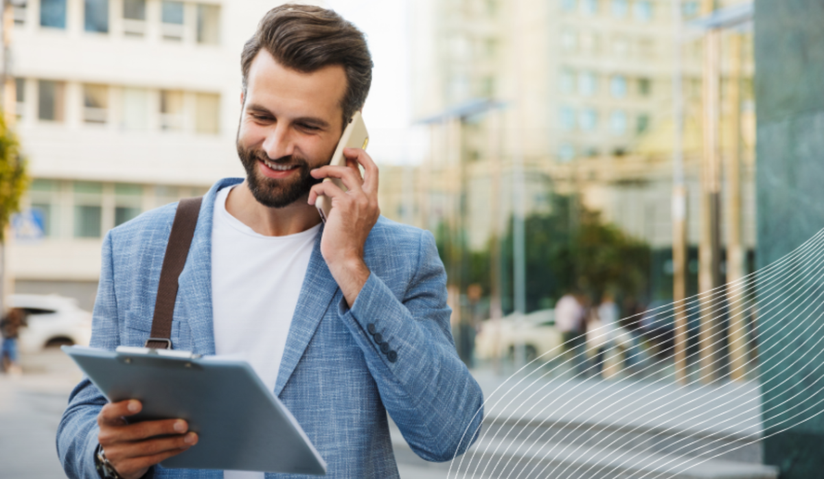 Image of a man smiling with more time and money as a result of Smarter Energy Procurement. Text overlay that says 'The Ultimate Guide to Smarter Energy Procurement. Built for Property Managers.'